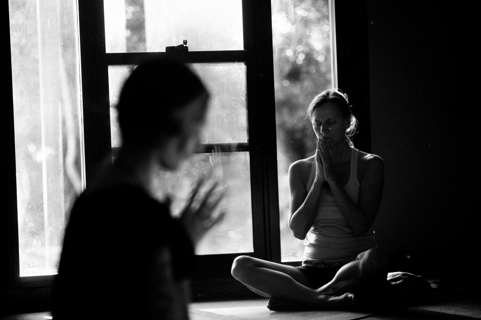 Black and white meditation by the window with Adya